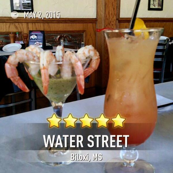 shrimp coctail and a cocktail